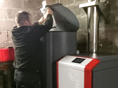 Photo showing wood chips being added to silo